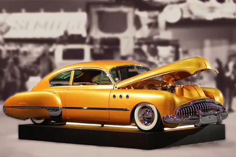 Archive photograph of a customized gold car displayed at the SEMA Show