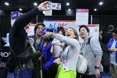 Visitors interacting with a technology demonstration at CES 2026