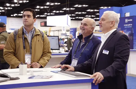 Exhibition booth and supplier discussions at Work Truck Week 2025