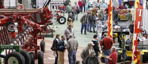 Visitors and farm machinery on the Hawkeye Farm Show exhibition floor at an earlier edition