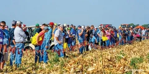 Archive photograph of visitors watching a field demonstration at Husker Harvest Days