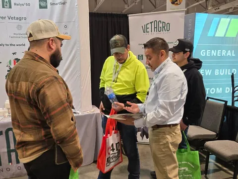 Visitors discussing products at a previous Central Plains Dairy Expo