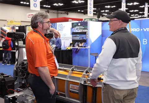 Exhibition booth and supplier discussions at Work Truck Week 2025