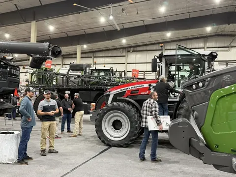 Visitors examining farm equipment at an earlier Nebraska Ag Expo